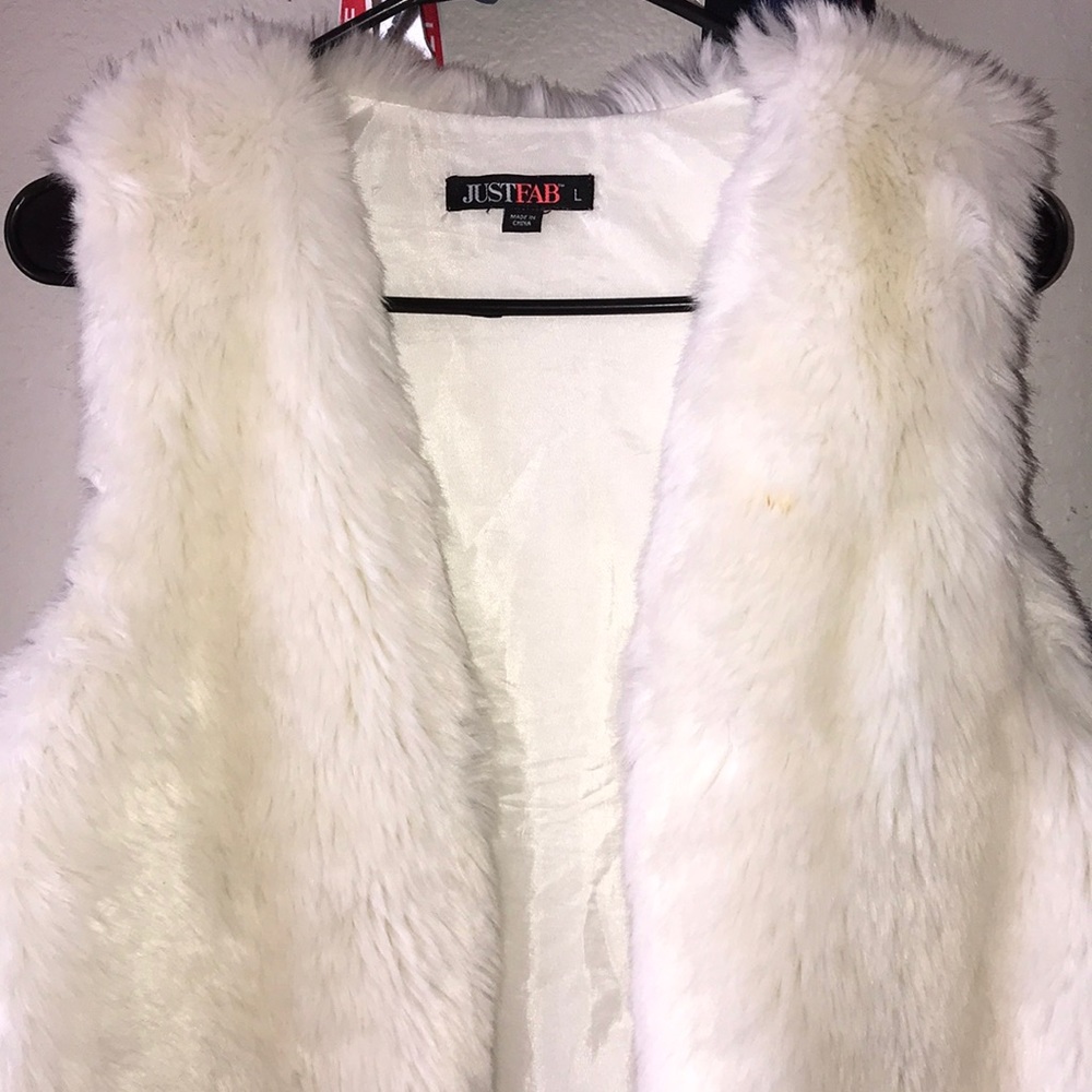 White fur vest